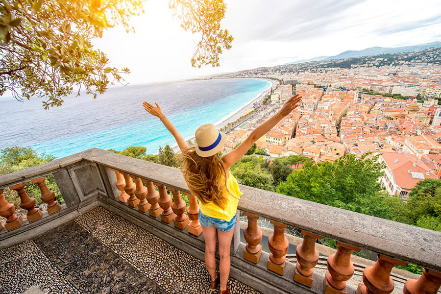 Young female traveler enjoying great view on the Nice city in France