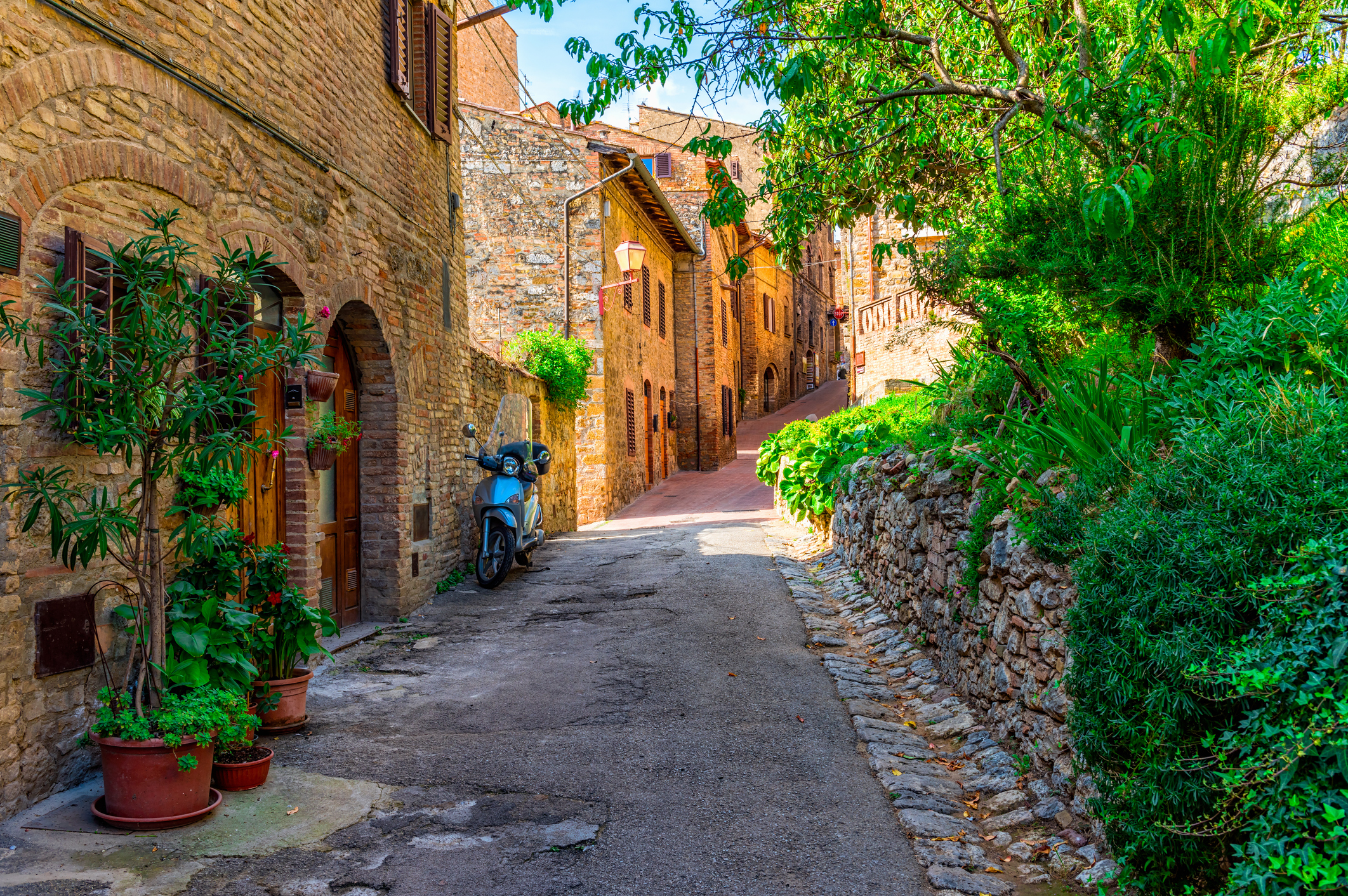 Old street in San Gimignano, Tuscany, Italy. San Gimignano is typical Tuscan medieval town in Italy